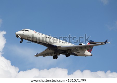 LOS ANGELES, CALIFORNIA, USA - MARCH 8, 2013 - Delta Connection Bombardier CRJ-701 lands at Los Angeles Airport on March 8, 2013. The plane has a range of 2,656 km with 66 seats.
