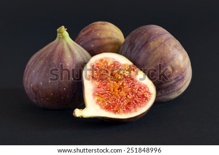 Several figs on the dark background