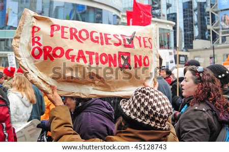 TORONTO - JANUARY 23:  A woman holding up a perogie sign at a rally protesting against Prime Minister Harper's decision to prorogue Parliament on January 23, 2010 in Toronto, Ontario.