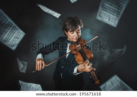 Musician plays the violin and music sheets flying around