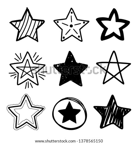 Set of black hand drawn doodle stars in isolated on white background.