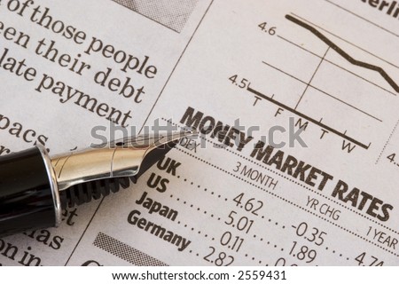 Money matters - Fountain pen rests on financial newspaper