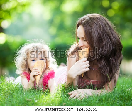 Similar – Image, Stock Photo Funny kid girl eating sandwich outdoors. Having fun. Looking at camera. Posing over nature background. Healthy food. Childhood.