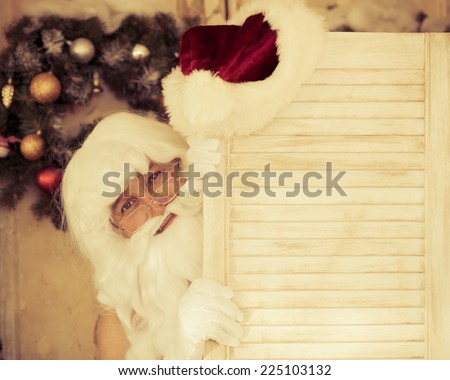 Funny Santa Claus man change clothes. Christmas holiday concept
