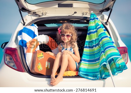 Child on vacation. Summer holiday and car travel concept