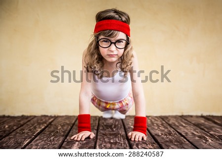 Funny strong child. Girl power and feminism concept
