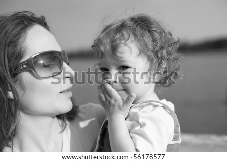 Woman with child - black and white, shallow depth of field