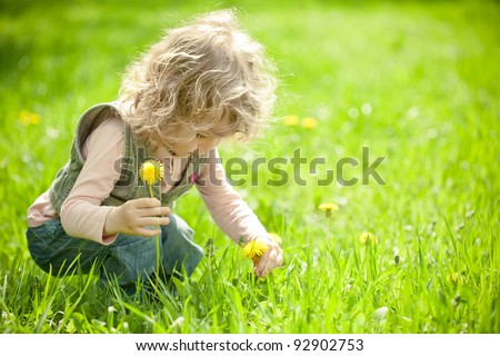 Image, Stock Photo Child picking spring flowers