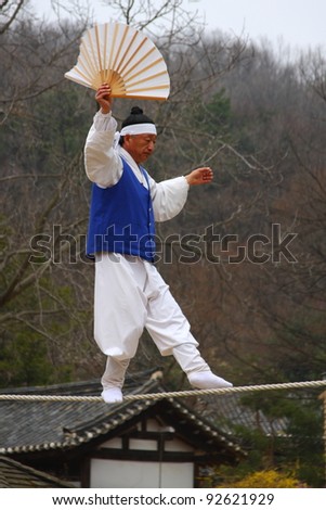 YONGIN - APRIL 18:  Acrobatics on the tightrope  at Korean Folk Village on April 18, 2010 in Yongin, South Korea. Korean Folk Village is a living museum type of tourist attraction.