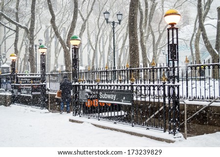 NEW YORK-JANUARY 21: A woman enters the Bryant Park subway station during Winter Storm Janus on January 21, 2014 in Manhattan.