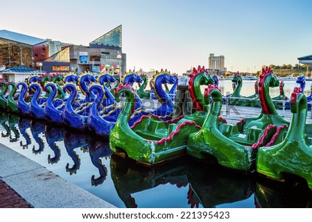 BALTIMORE, MARYLAND-SEPTEMBER 27-Colorful pedal boats for rent at the Inner Harbor on September 27 2014 in Baltimore Maryland. The Inner Harbor is a very popular tourist destination.