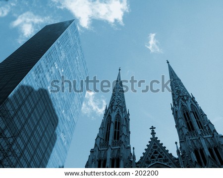 This is a blue duo-tone of St. Patrick\'s Cathedral and a skyscraper\
\
in New York.