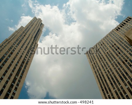 This is a high impact shot of two tall buildings and some dramatic clouds.