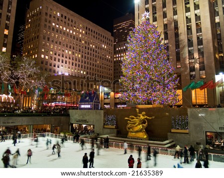 Rockefeller Center, New York, Dec 5th 2008: Ice skaters and tourists are all around the famous Rockefeller Center Christmas tree during the holidays.