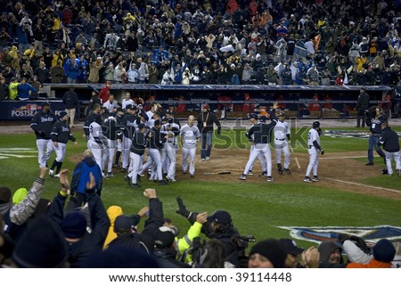 YANKEE STADIUM, BRONX, OCTOBER 17:  Derek Jeter crosses home plate after hitting a solo home run in the third inning of the ALCS at Yankee Stadium on October 17, 2009 in the Bronx, New York.