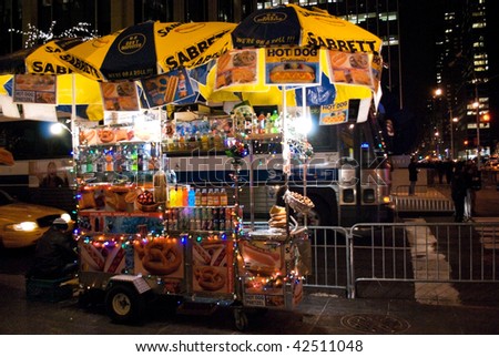 MANHATTAN - DECEMBER 4: A New York city street vendor get into the holiday spirit with lights on his cart on December 7, 2009 in New York City.