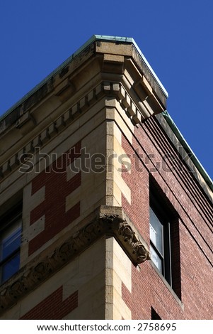 corner of old building in boston, one side in light other side in shadow