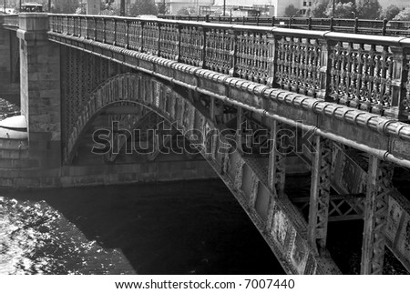 detail of old iron bridge in boston over the river charles