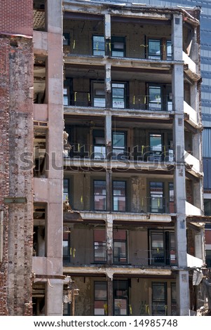 view of deconstruction site showing open shell of building as it is being torn down