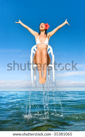 beautiful woman flying out of tropical water