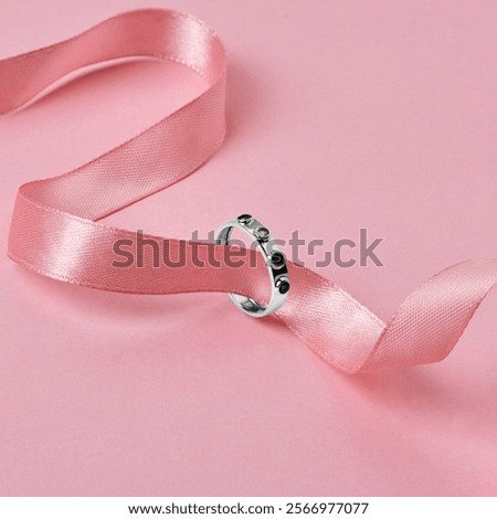 Similar – Image, Stock Photo Elegant earring in the glass with roses and rose petals