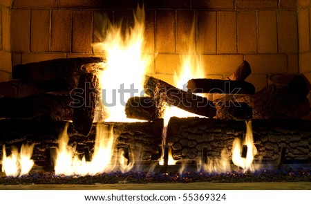 warm fireplace with a fire started