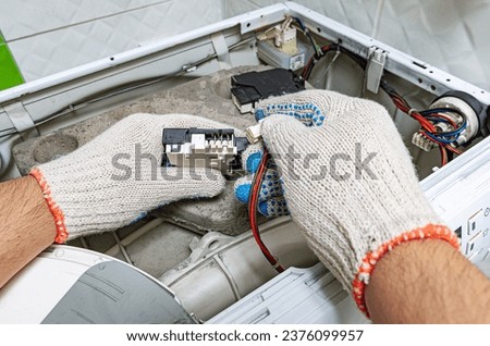 Similar – Image, Stock Photo Repairman fixing old broken motorcycle in workshop