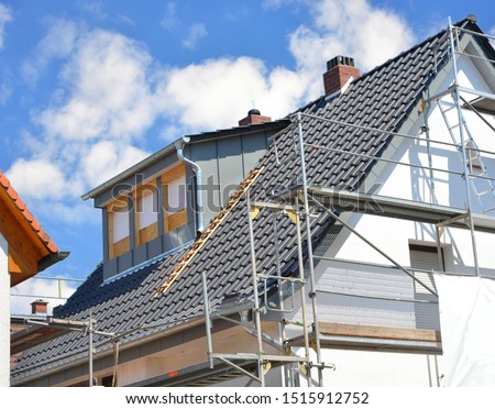 Renovation of a Dormer Window and new Tiling of a Roof Stock foto © 