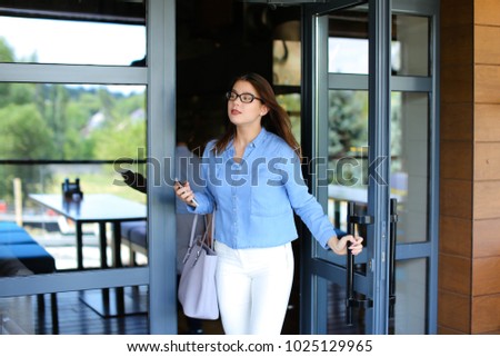 Similar – Image, Stock Photo Cheerful woman leaving restaurant