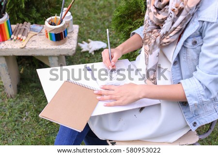 Similar – Image, Stock Photo Female artist drawing with pencil in art studio