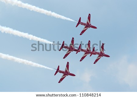 ZHUKOVSKY, RUSSIA - AUGUST 12: five BAe Hawk jets from Red Arrows display team fly in formation during the celebration of the centenary of Russian Air Force on August 12, 2012 in Zhukovsky, Russia