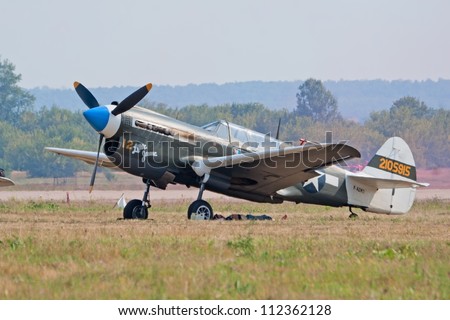 ZHUKOVSKY, RUSSIA - AUGUST 12: P-40 Kittyhawk historic fighter plane stand on the flight lane during the celebration of the centenary of Russian Air Force on August 12, 2012 in Zhukovsky, Russia