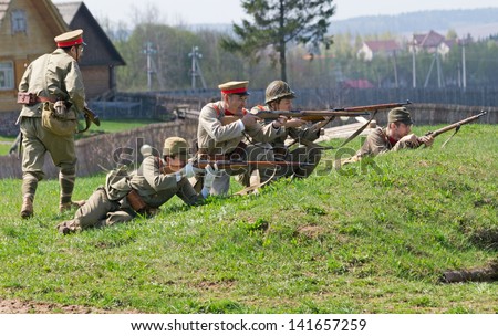 LOSHANY, BELARUS - MAY 5: military history club members in Imperial Japanese uniform hold position during historical reenacting show at Stalin\'s Line memorial on May 05, 2013 in Loshany, Belarus