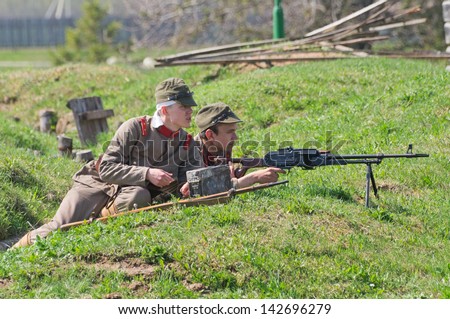 LOSHANY, BELARUS - MAY 5: two military history club members in Imperial Japanese uniform hold position during historical reenacting show at Stalin\'s Line memorial on May 05, 2013 in Loshany, Belarus