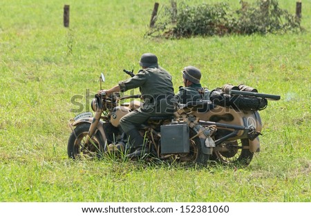DUBOSEKOVO, RUSSIA - JULY 13: military history club members in German WWII uniform ride a BMW R75 bike during Field of Battle military history festival on July 13, 2013 in Dubosekovo, Russia