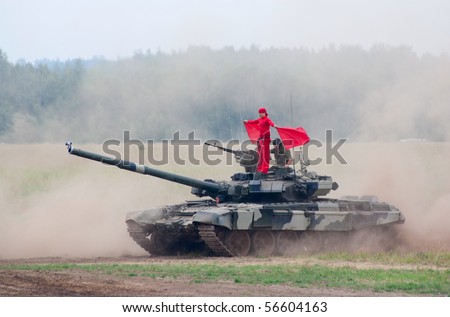 ZHUKOVSKY, RUSSIA - JULY 3: T-80 tank moves with a red flag carrier standing on the top at the Forum ET-2010 on July 03, 2010 in Zhukovsky, Russia