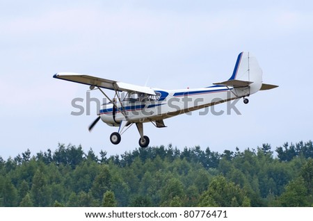TVER, RUSSIA - JULY 09: Yak-12 plane flies low during the Tver Blue Skies aviation festival on July 09, 2011 in Tver, Russia