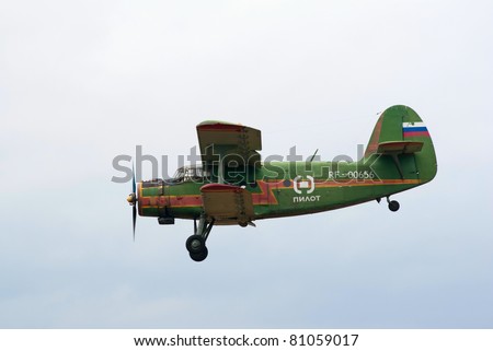 TVER, RUSSIA - JULY 09: Antonov An-2 multipurpose biplane flies during the Tver Blue Skies aviation festival on July 09, 2011 in Tver, Russia