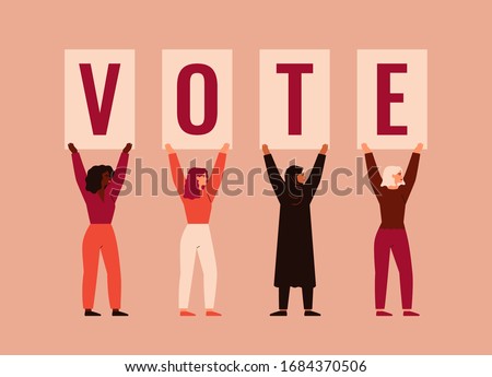 Strong girls different nationalities and cultures stand together and raise up posters with word VOTE. Women activists are calling for votes. Voting and Election concept. Pre-election campaign.