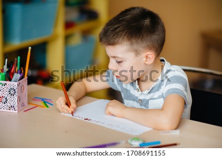 Similar – Image, Stock Photo Boy does homework