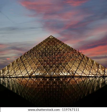 PARIS - MAY 8: Louvre Pyramid at dusk on May 8, 2012 in Paris, France. The Louvre is the biggest Museum in Paris displayed over 60,000 square meters of exhibition space