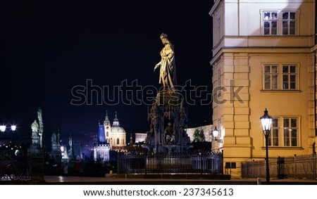 Night view of statue on the Charles Bridge in Prague, Czech Republic
