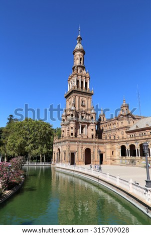 SEVILLE, SPAIN- AUGUST 27, 2014: Famous Plaza de Espana and tourists (was the venue for the Latin American Exhibition of 1929 )  - Spanish Square in Seville, Andalusia, Spain