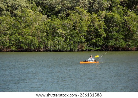 EVERGLADES NATIONAL PARK, FL - NOVEMBER 1: A fisherman on a kayak makes his way into the popular Flamingo Marina November 1, 2014 in Everglades National Park, FL.