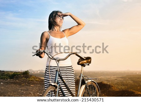 Similar – Image, Stock Photo Woman with bicycle seeks way on smartphone