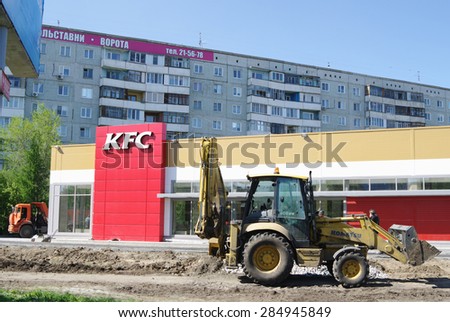 OMSK, RUSSIA - MAY 12, 2015: Landscaping in front of new building of network  KFC restaurant.