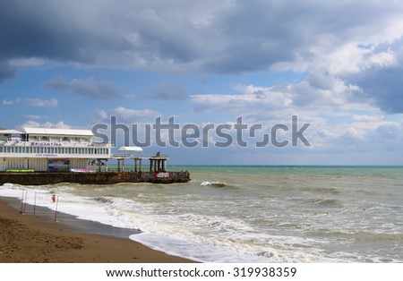 SUDAK, RUSSIA  - SEPTEMBER 24, 2014:  Black sea coast, sea surf, view hotel \