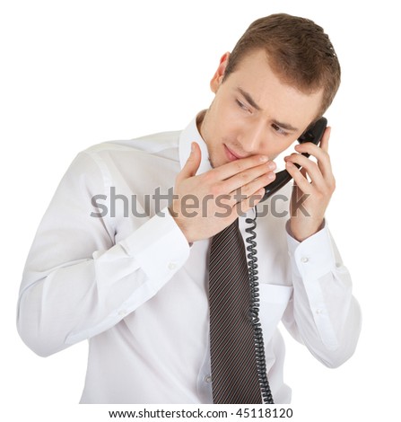 young man in a business suit and a telephone in his hand on a white background