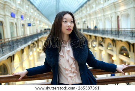 Half-length portrait of Asian sad girl.