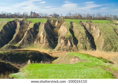 Ukranian landscape with soil erosion in early spring season.